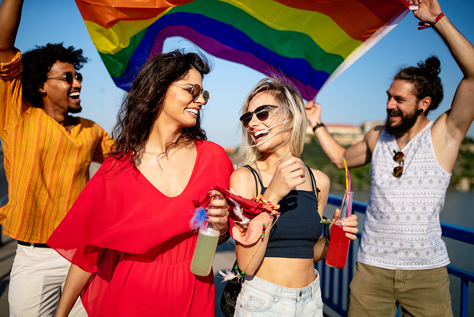 Group of travelers with pride flag